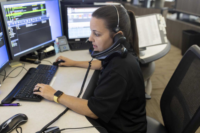 Heather Silvio, dispatch center supervisor, takes a phone call at the Conroe PD dispatch office, Thursday, April 30, 2020.